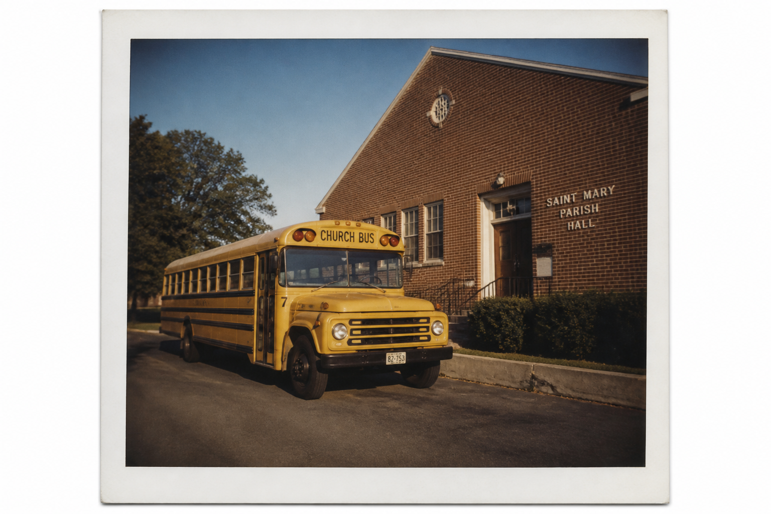 Yellow church bus at a brick parish hall.